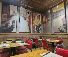 Intérieur chaleureux d’une pizzeria Marmiton Pizza 2 Pour 1